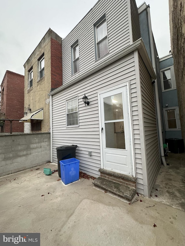 back of property featuring a patio