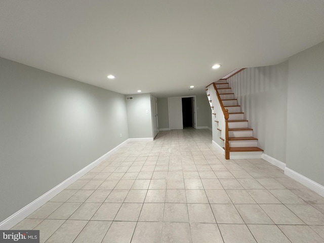 basement with light tile patterned flooring