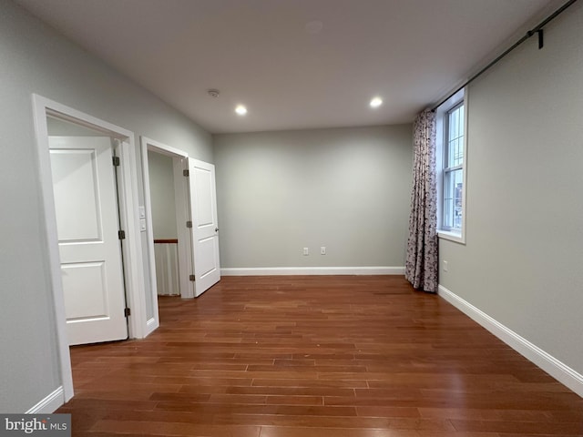 empty room featuring dark hardwood / wood-style floors