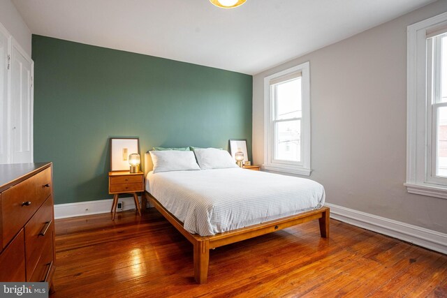 bedroom featuring wood-type flooring