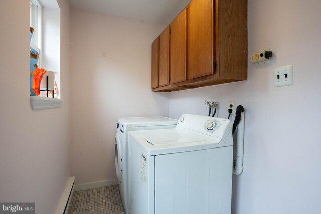 washroom featuring independent washer and dryer, cabinets, and a baseboard radiator