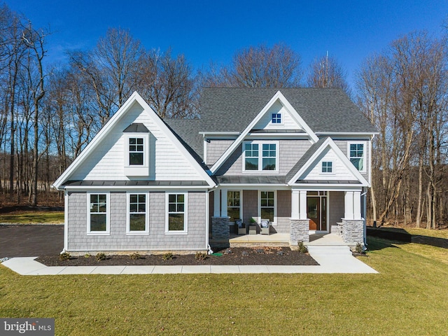 craftsman-style house featuring a front yard and a porch