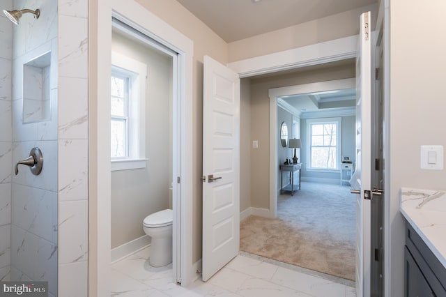 bathroom with vanity, ornamental molding, and toilet