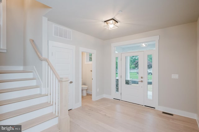 foyer with light hardwood / wood-style floors