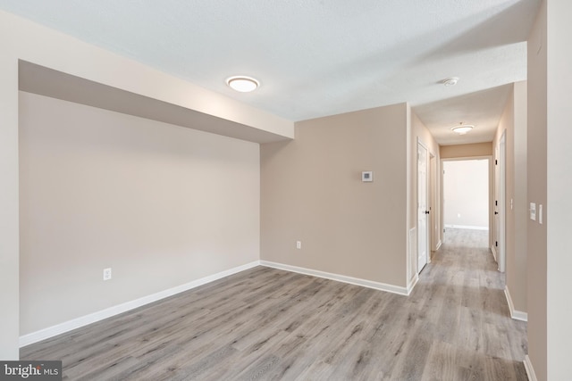 unfurnished room featuring light wood-type flooring