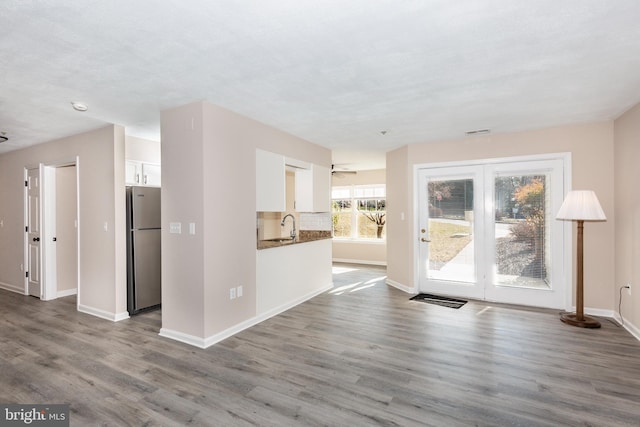 unfurnished living room with wood-type flooring