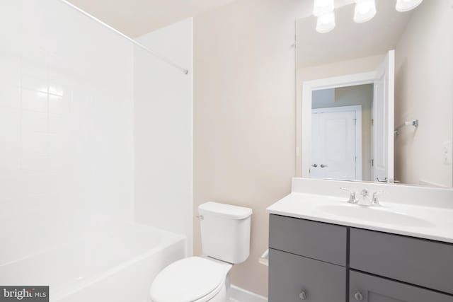 full bathroom featuring vanity, toilet, and  shower combination