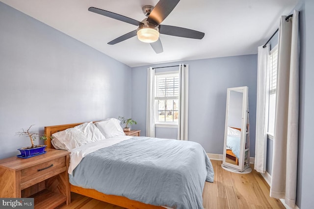 bedroom featuring ceiling fan and light hardwood / wood-style flooring