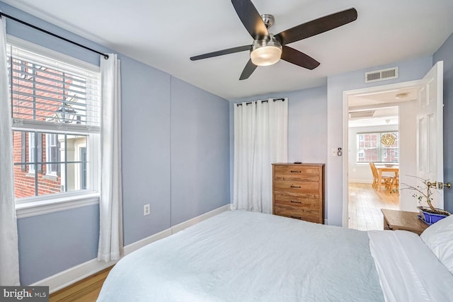 bedroom featuring light hardwood / wood-style floors and ceiling fan