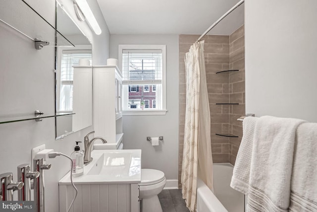 full bathroom with vanity, tile patterned floors, toilet, and shower / bath combo