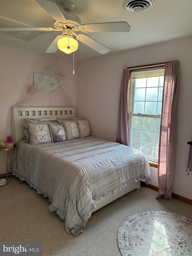 carpeted bedroom with ceiling fan