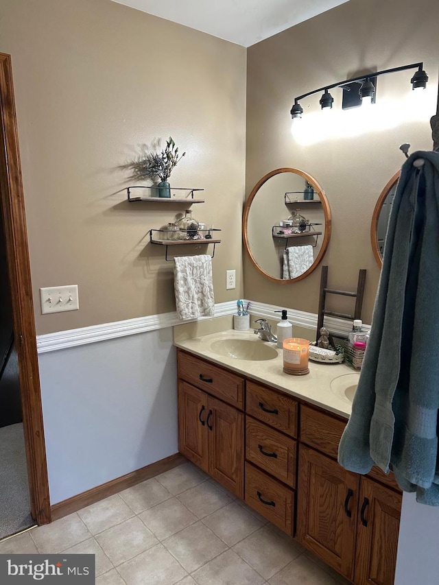 bathroom with vanity and tile patterned flooring