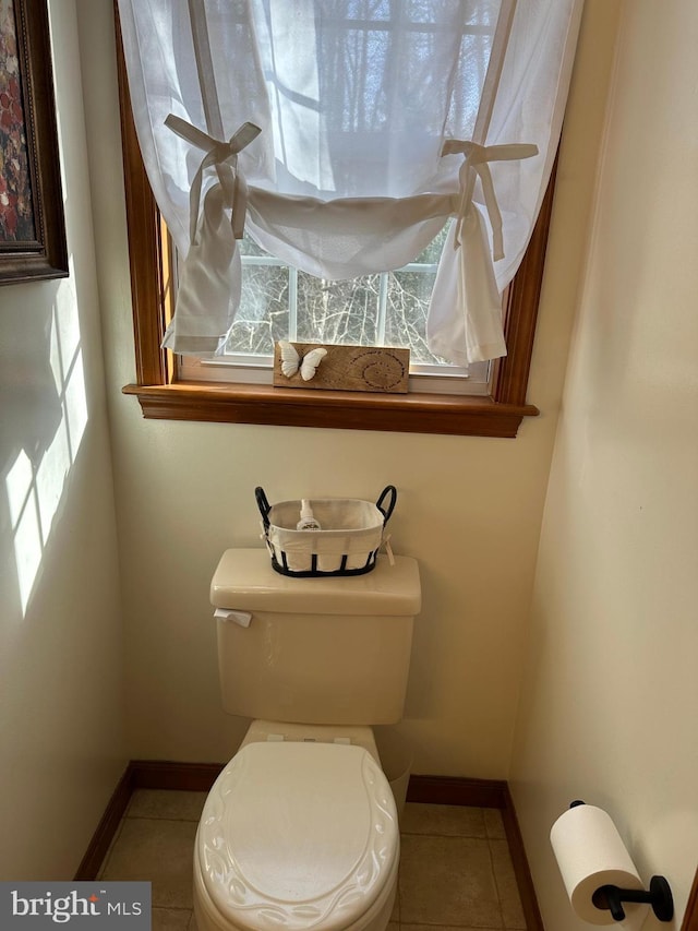 bathroom with tile patterned floors and toilet