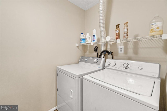 laundry room with washer and clothes dryer