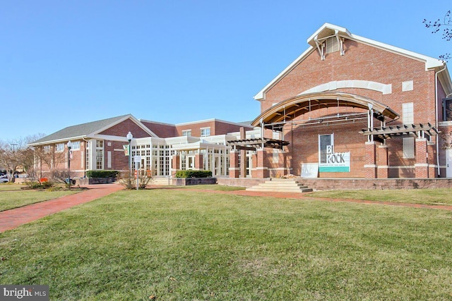 surrounding community featuring a pergola and a lawn