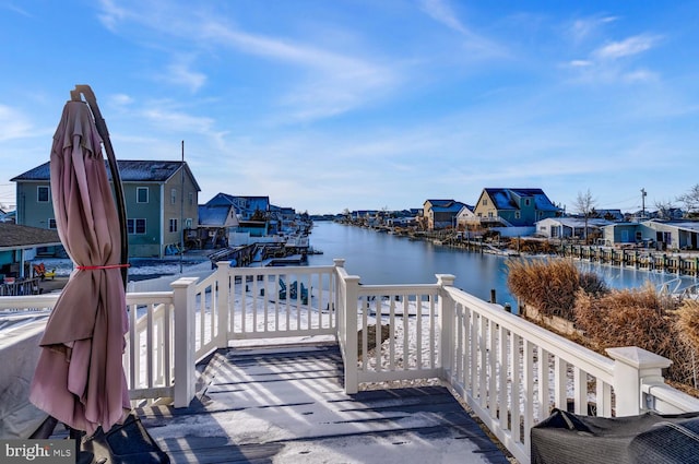 view of dock with a deck with water view