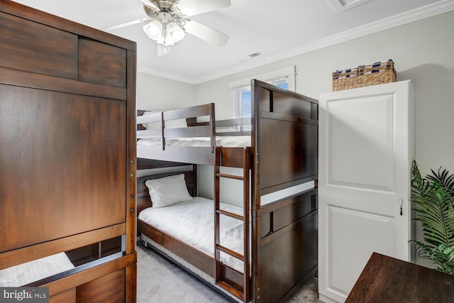 bedroom with crown molding, light carpet, and ceiling fan