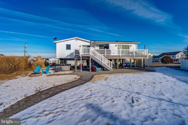 back of house featuring a deck