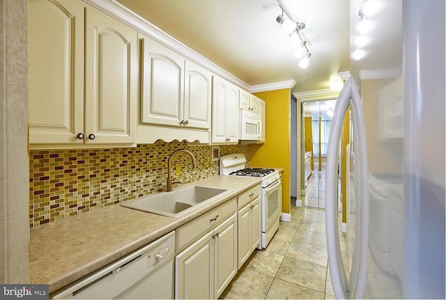 kitchen with light tile patterned flooring, sink, decorative backsplash, crown molding, and white appliances