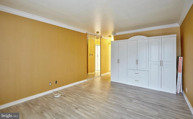 unfurnished bedroom with crown molding, a closet, and light hardwood / wood-style flooring