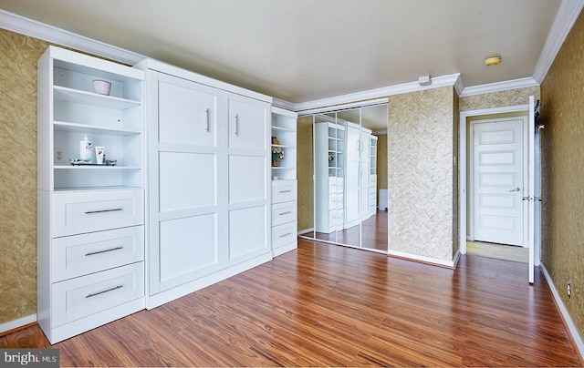 unfurnished bedroom with ornamental molding and dark hardwood / wood-style flooring