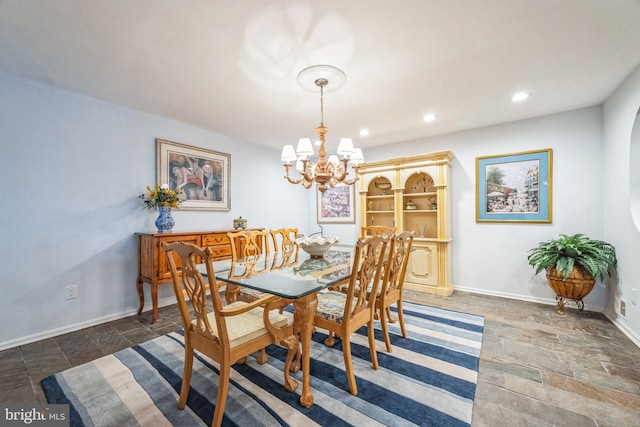 dining room featuring a notable chandelier