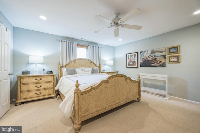 bedroom featuring light carpet and ceiling fan