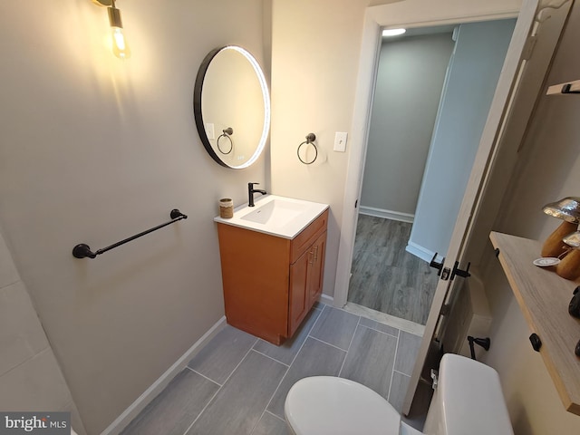 bathroom with vanity and toilet