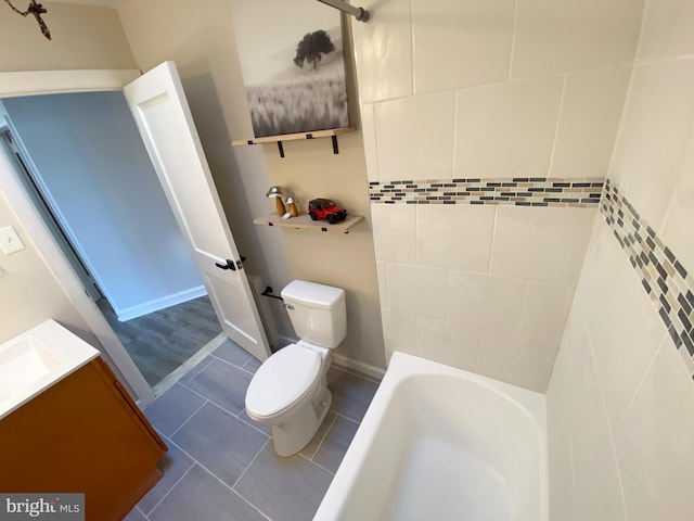 bathroom with vanity, tile patterned floors, and toilet