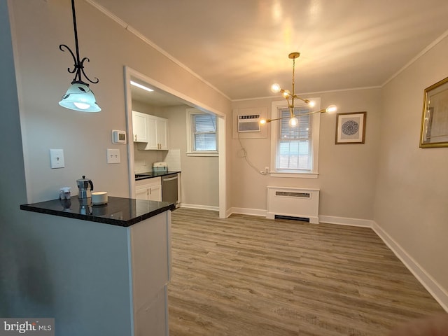 dining area with ornamental molding, wood-type flooring, a wall mounted air conditioner, and heating unit