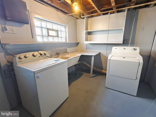 laundry area featuring separate washer and dryer and sink