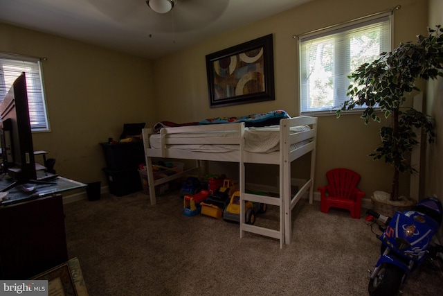 carpeted bedroom featuring ceiling fan