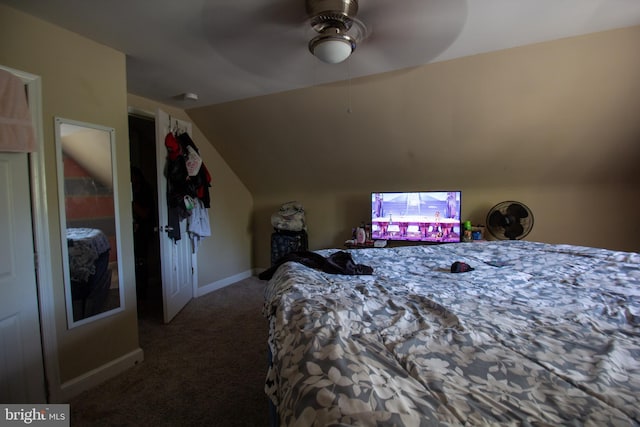 carpeted bedroom with vaulted ceiling