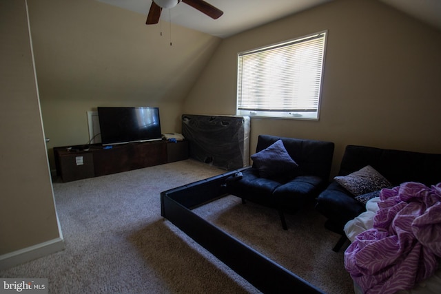 carpeted living room featuring ceiling fan and lofted ceiling