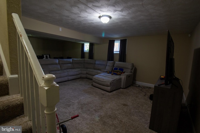 carpeted living room with a textured ceiling