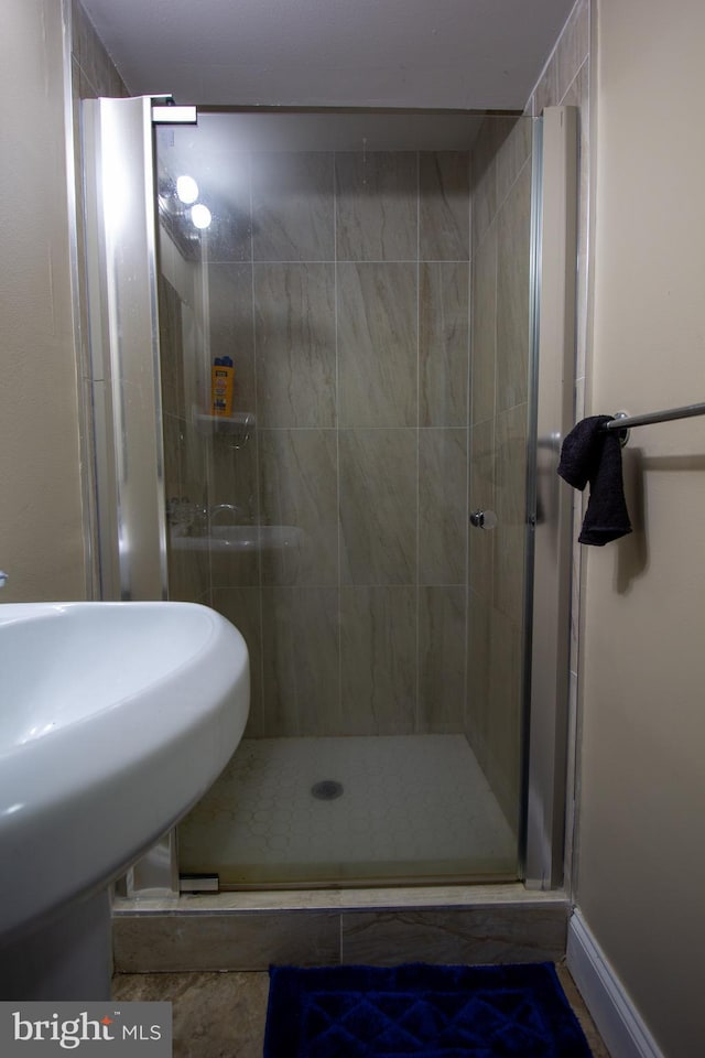 bathroom featuring sink and walk in shower