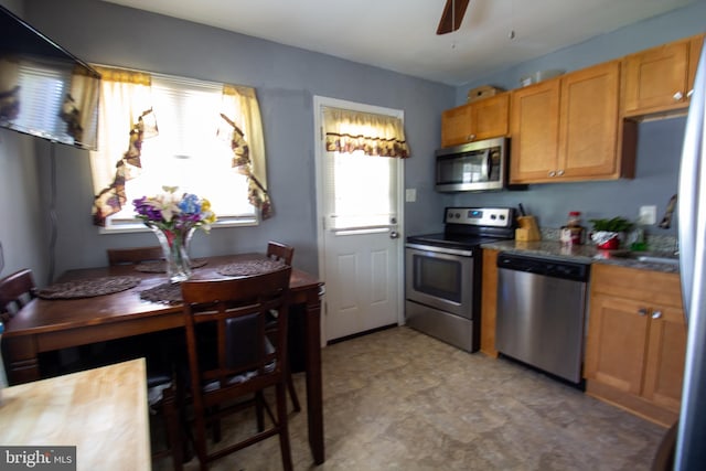 kitchen with ceiling fan and appliances with stainless steel finishes