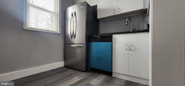 kitchen with sink, stainless steel refrigerator, dark hardwood / wood-style flooring, dishwasher, and white cabinets