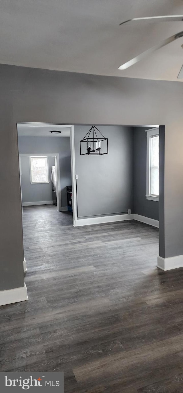 spare room with dark hardwood / wood-style flooring