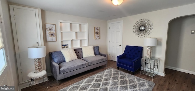 living room with dark hardwood / wood-style floors