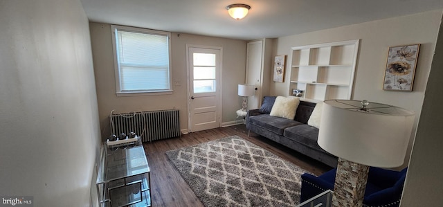 living room featuring radiator and dark hardwood / wood-style flooring