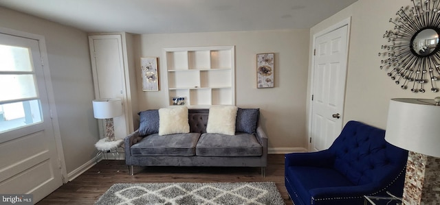 living area featuring dark wood-type flooring and a wealth of natural light