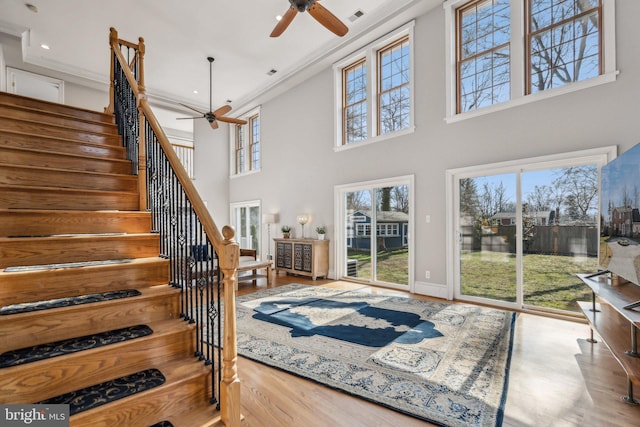 interior space featuring plenty of natural light, hardwood / wood-style floors, and ceiling fan