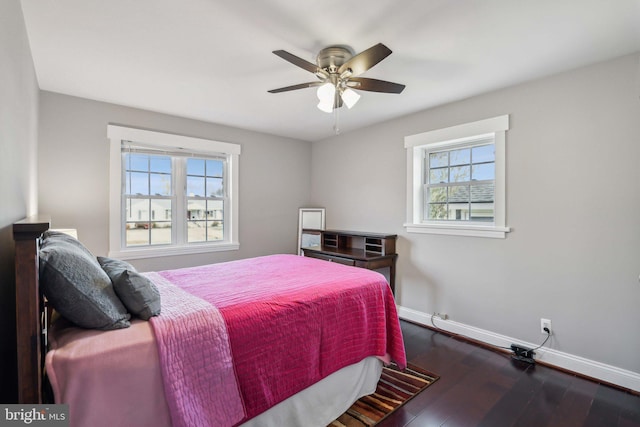 bedroom featuring dark hardwood / wood-style flooring and ceiling fan