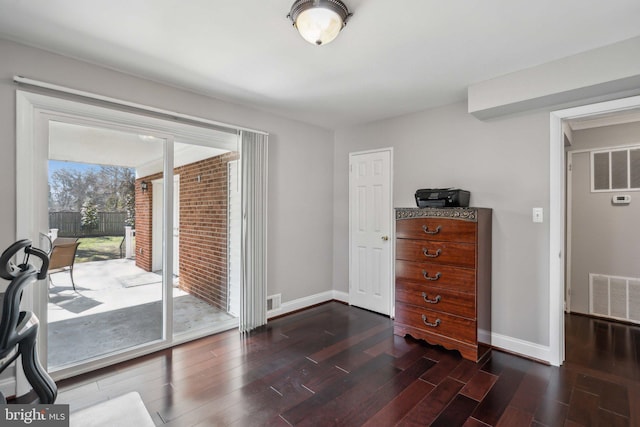 sitting room featuring dark wood-type flooring