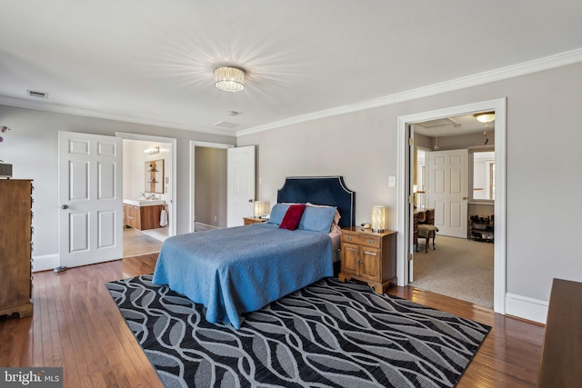 bedroom featuring crown molding and light hardwood / wood-style flooring