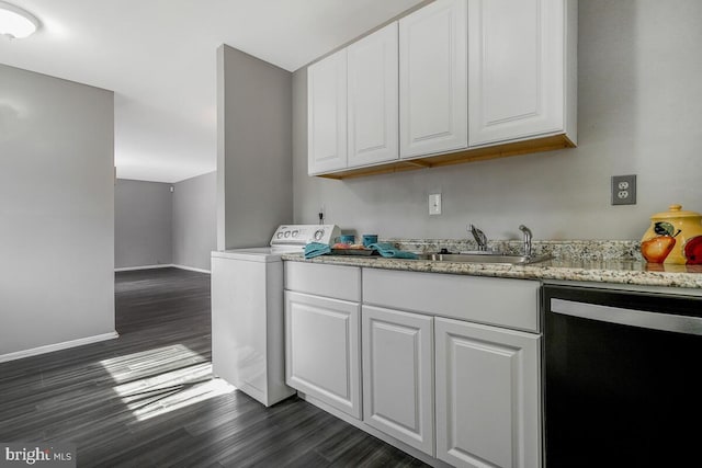 kitchen featuring washer / clothes dryer, black dishwasher, sink, and white cabinets