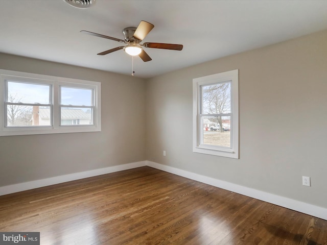 spare room featuring hardwood / wood-style flooring and ceiling fan