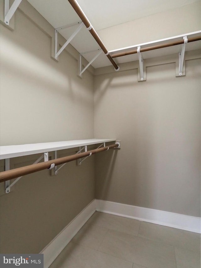 walk in closet featuring tile patterned floors