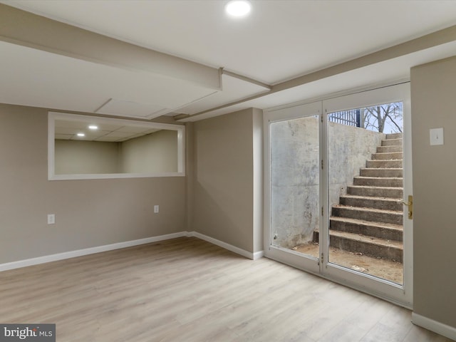 basement featuring light hardwood / wood-style floors